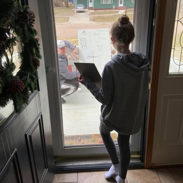 math-teacher-helps-student-from-her-front-porch