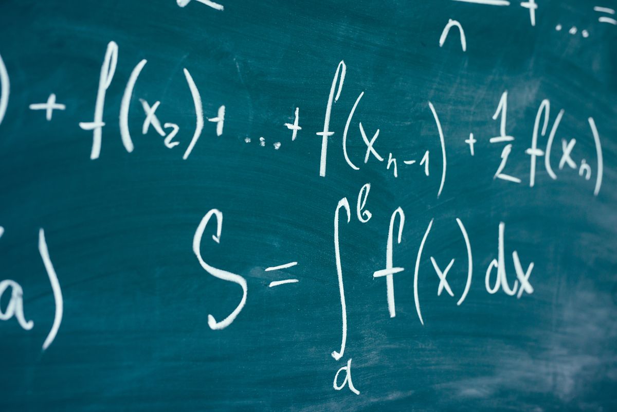 mathematics function integra formulas written by chalk on the chalkboard