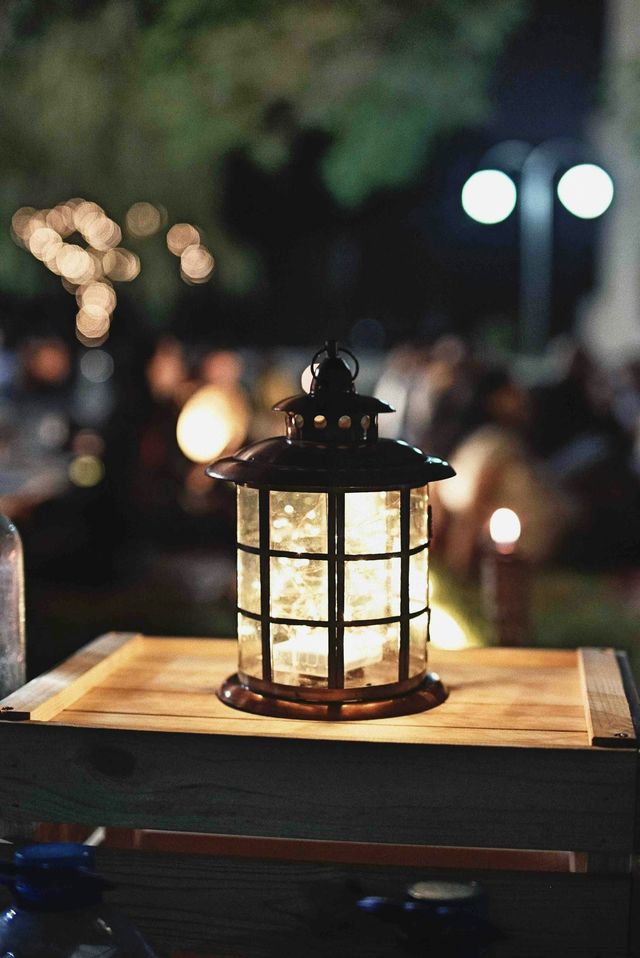 a glass lantern on a table