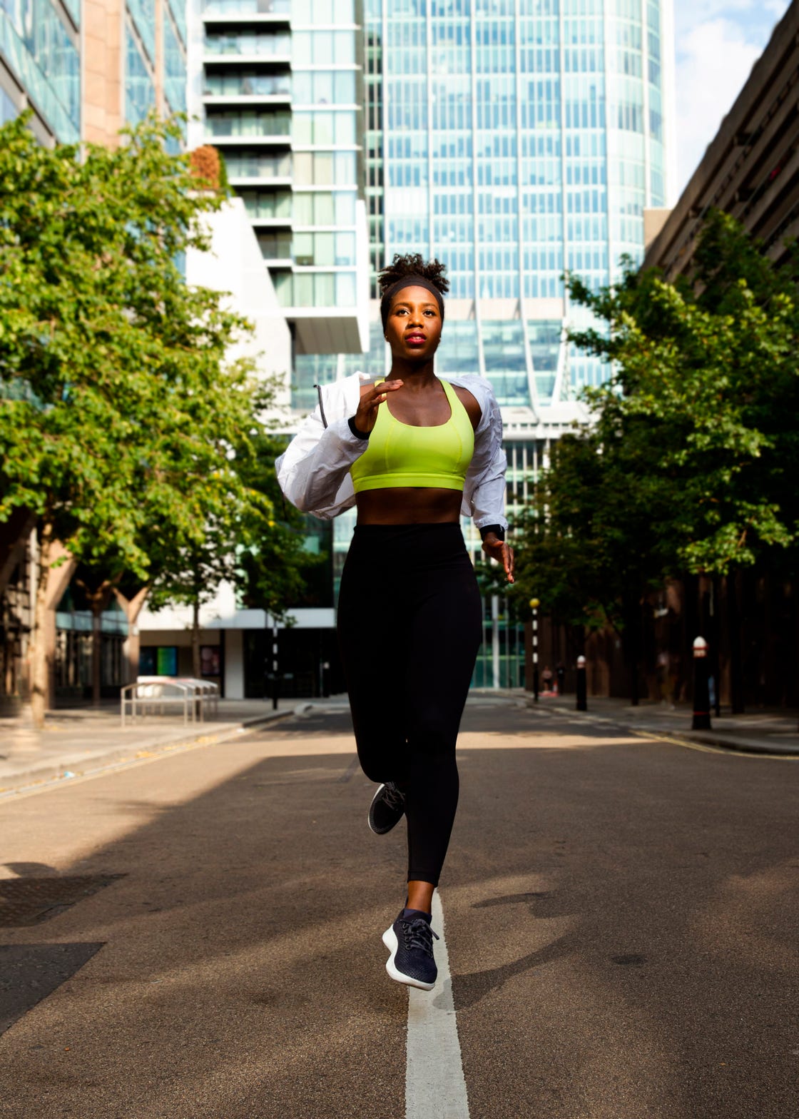 Human leg, Building, Active pants, Urban area, Tower block, Street, sweatpant, Asphalt, Knee, yoga pant, 