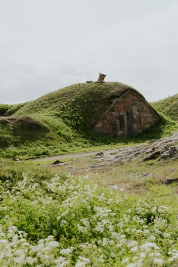 a stone building on a hill