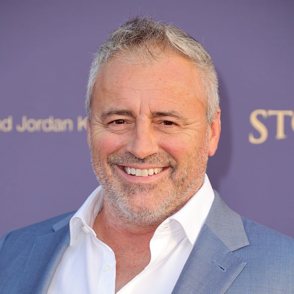matt leblanc wearing a light colored suit and smiling for a photo at a benefit event