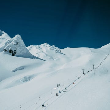 a group of people skiing down a mountain