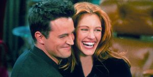 304422 21 actor matthew perry and actress julia roberts hug each other on the set of friends photo by liaison