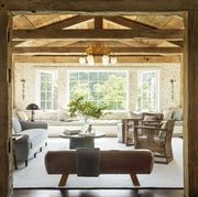 living room with reclaimed ceiling beams