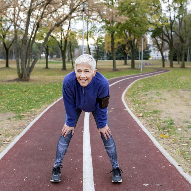 Mature Athlete Woman Taking a Break After Jogging