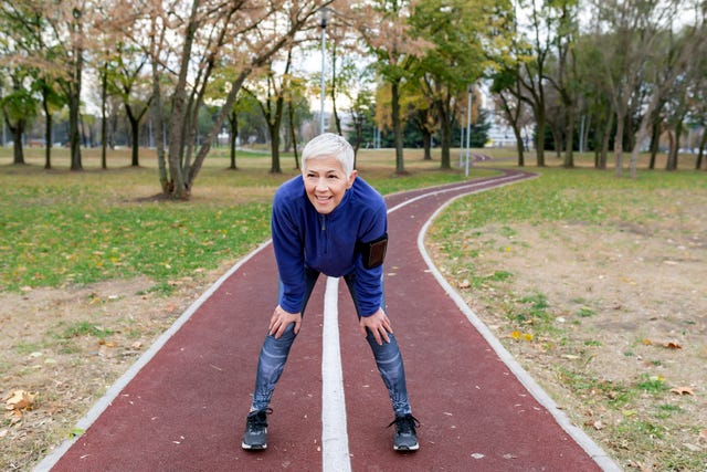 Mature Athlete Woman Taking a Break After Jogging