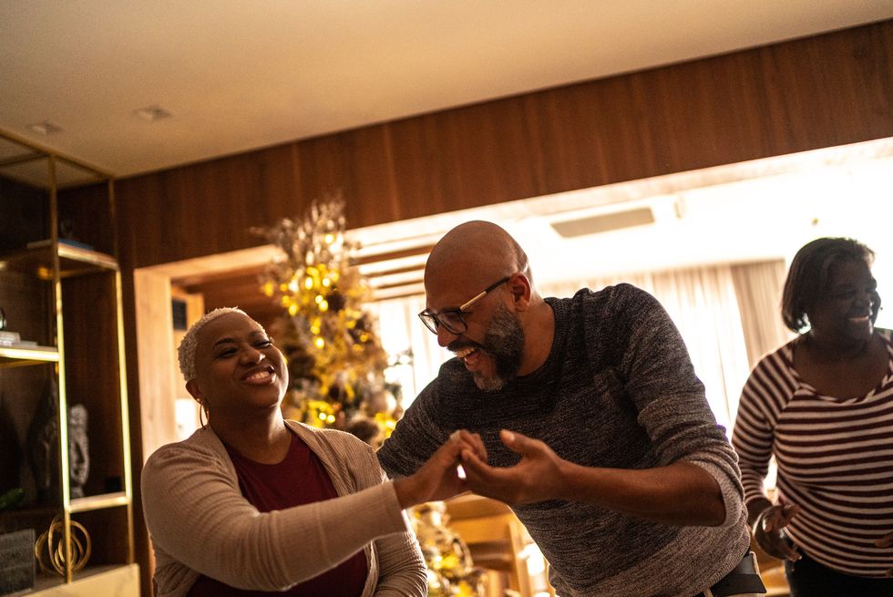 mature couple dancing on christmas day at home