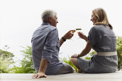 dating sites over 50 mature couple toasting wineglasses