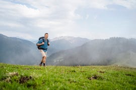 mature male backpacker hiking on mountain