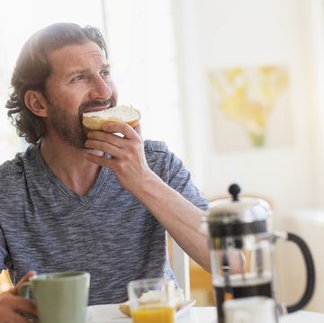 mature man eating breakfast