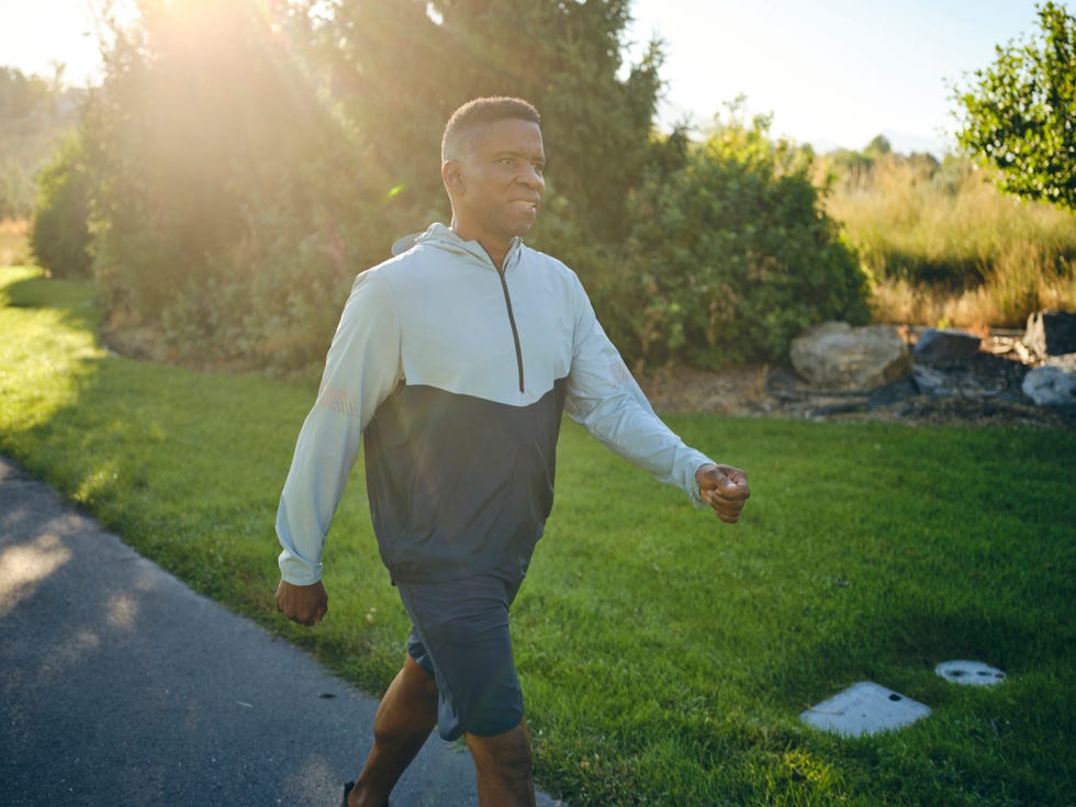 mature man exercising in a park in the morning