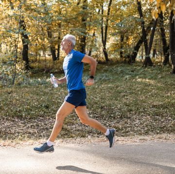 mature man running through the park