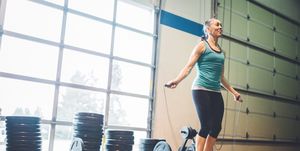 Mature Woman Jumping Rope in Gym Setting