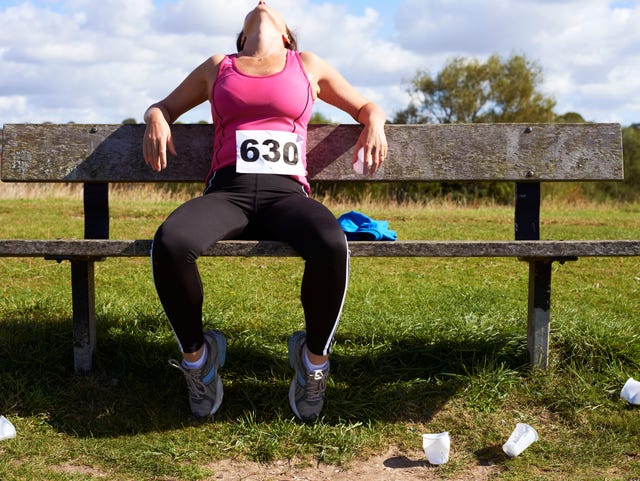 mature woman resting after competitive runningrace