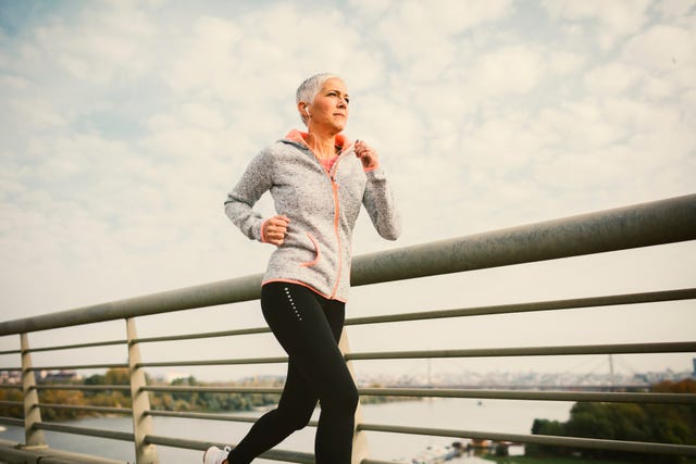Mature Woman Running The City