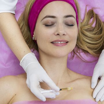mature woman with a doctor aesthetician in beauty hospital