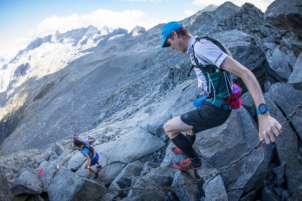 a man climbing a mountain