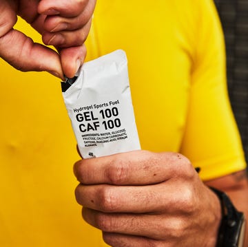 a person holding a maurten gel a person holding a maurten gel