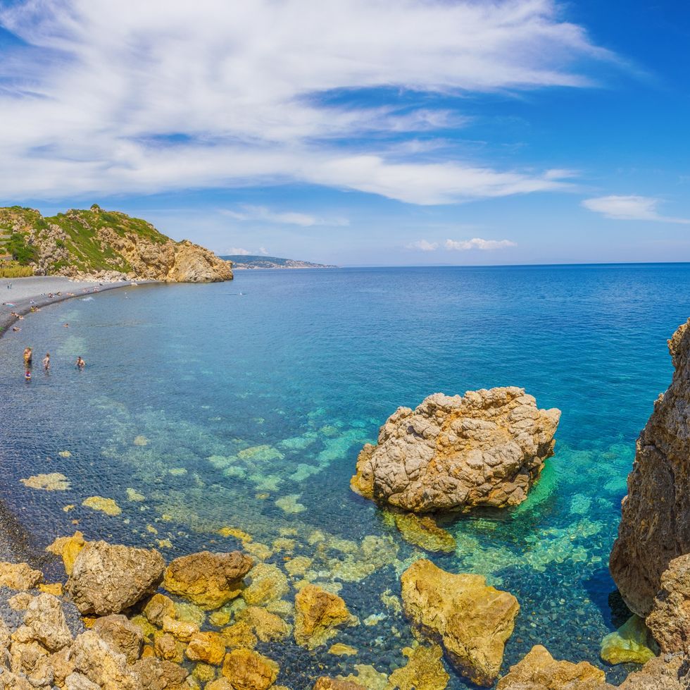 mavra volia beach made of volcanic stones in chios island, greece