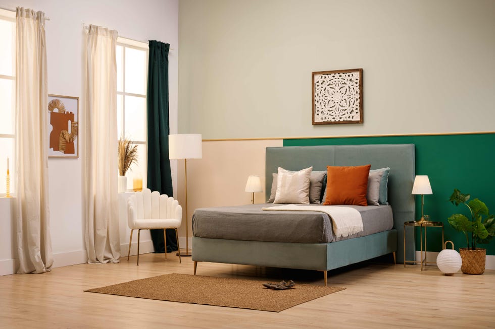a bedroom with a bed and lamps
