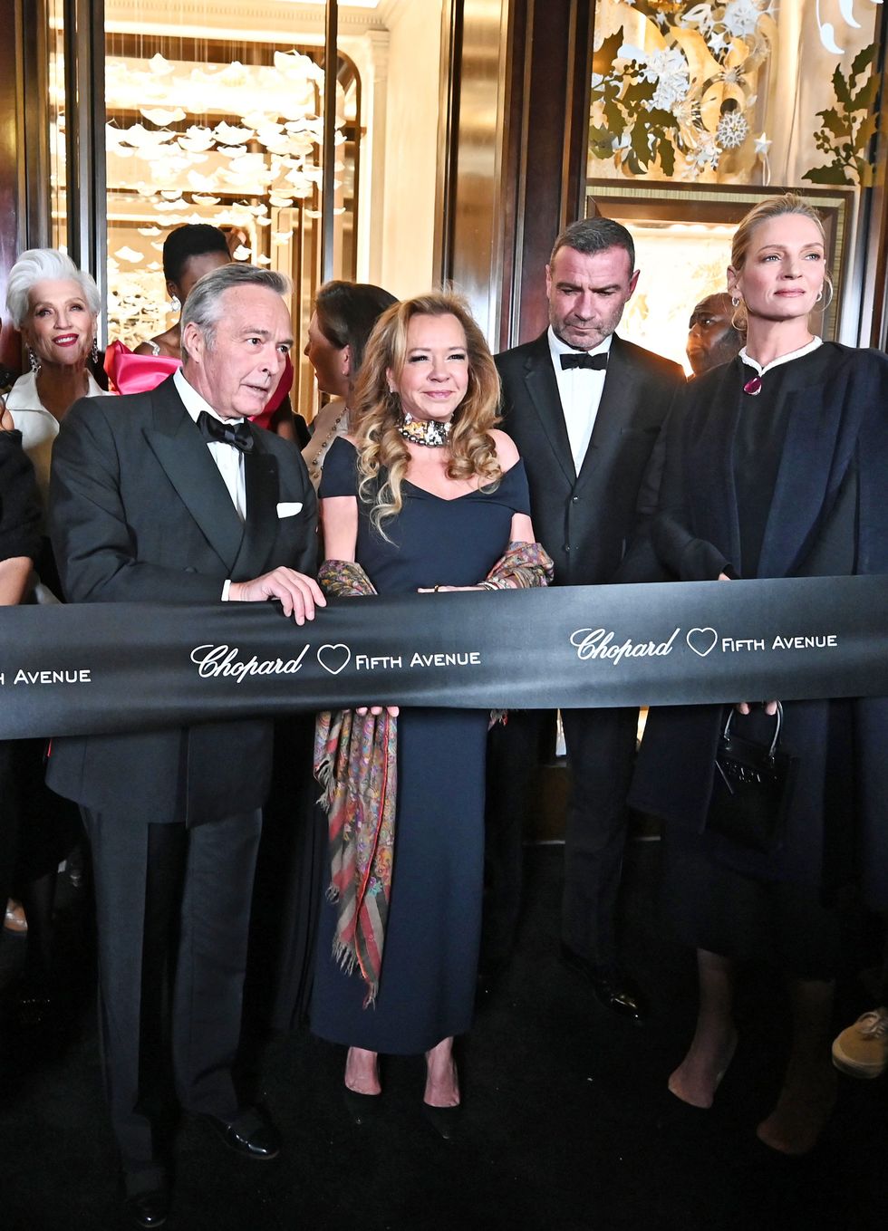new york, new york   december 05 katie holmes, maye musk, karl friedrich scheufele, christine scheufele, caroline scheufele, liev schreiber and uma thurman attend the ribbon cutting at the grand opening of chopard's new york flagship boutique on fifth avenue on december 05, 2022 in new york city photo by noam galaigetty images for chopard