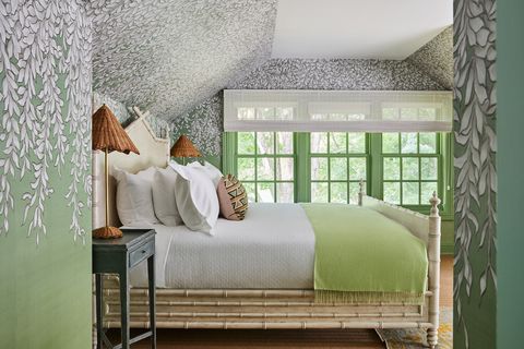 green walls with white flowers and green and white bedding