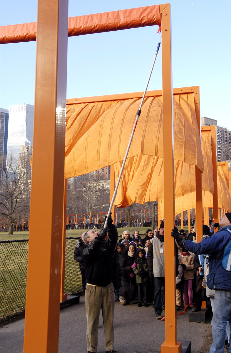 mayor michael bloomberg unfurls "the gates" by christo and jeanne claude in central park february 12, 2005