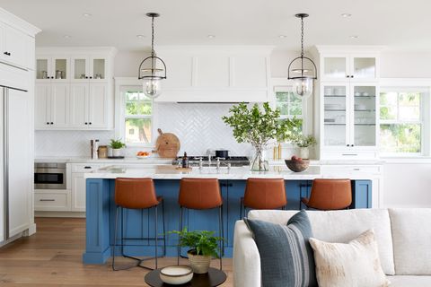 white kitchen with blue island