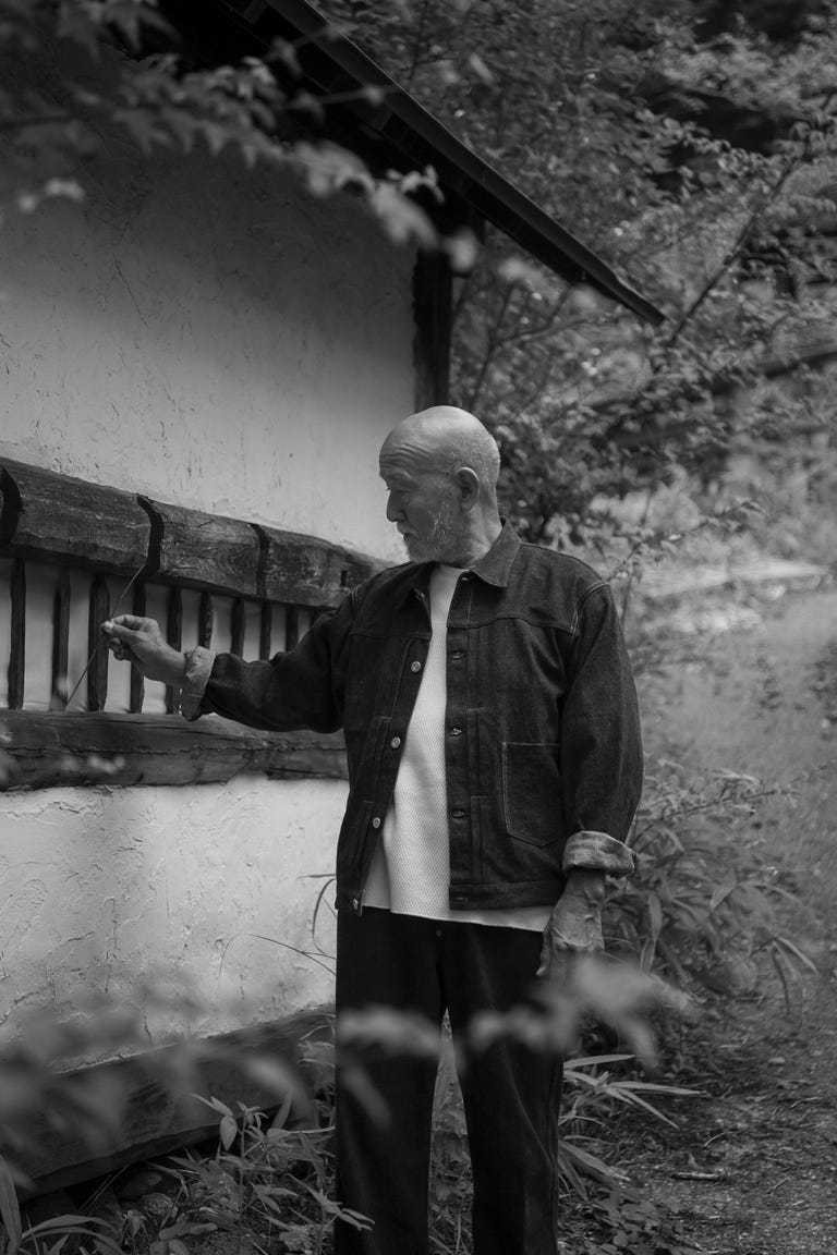 a man standing in front of a building