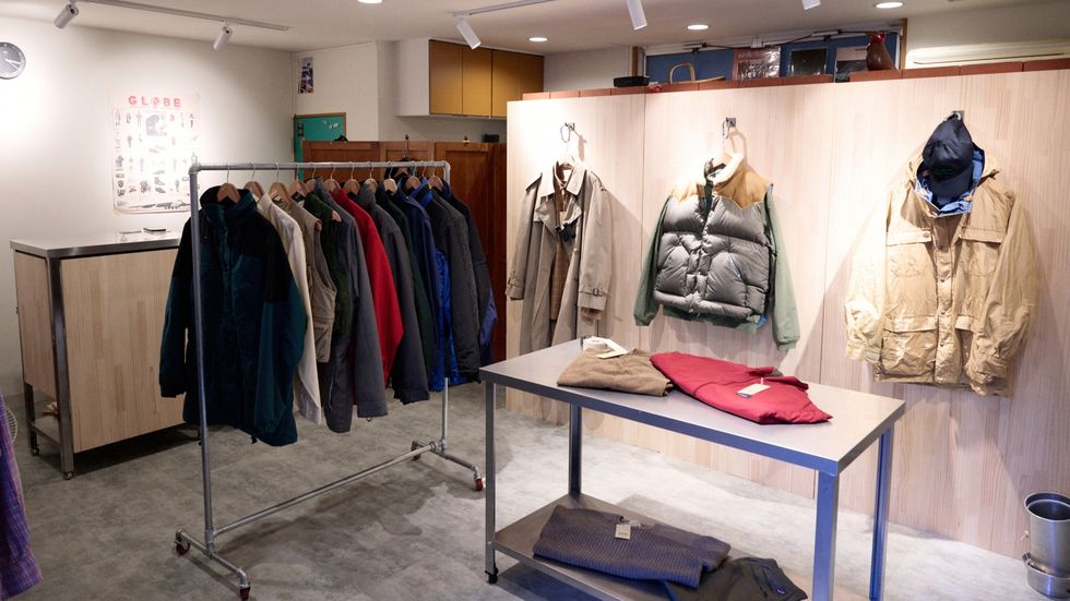 a store with a table and clothes on display