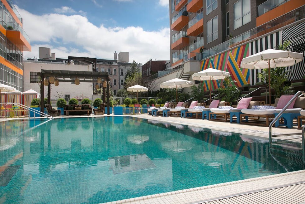 Swimming pool, Property, Resort, Building, Town, Real estate, Leisure, Condominium, Vacation, Resort town, 