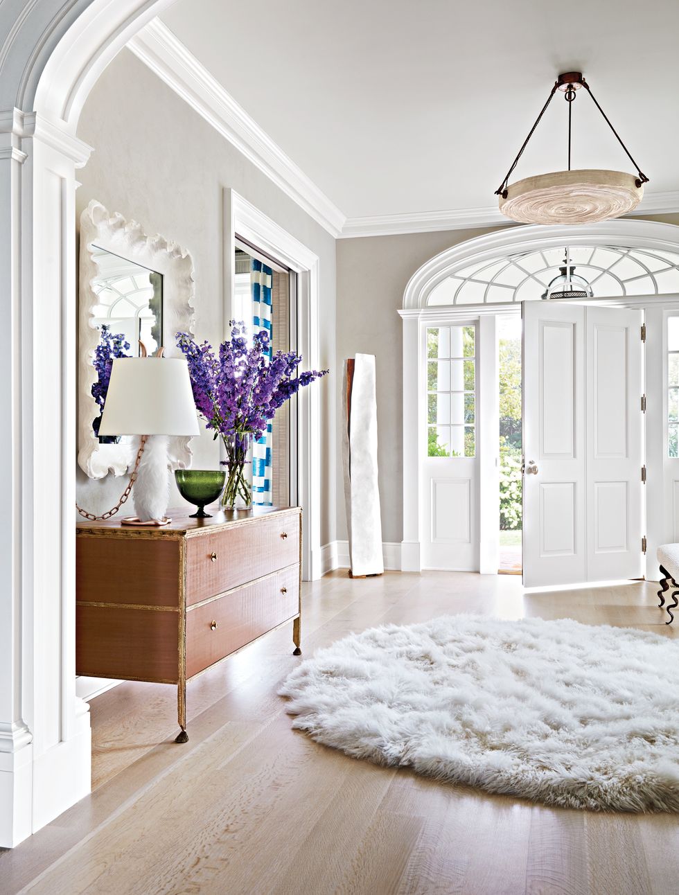 Entry hallway with white rug