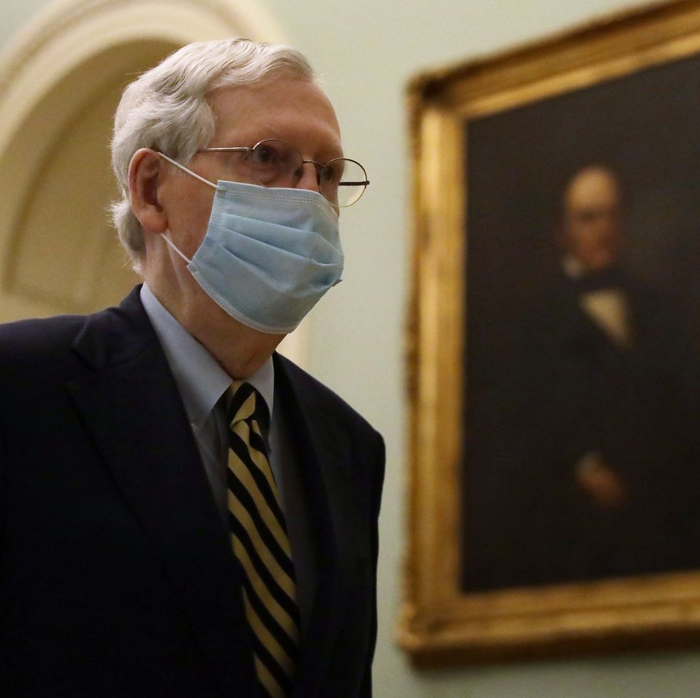 washington, dc   may 11  us senate majority leader sen mitch mcconnell r ky wears a mask as he walks through a hallway at the us capitol may 11, 2020 in washington, dc the senate is back in session for the second week after a pause due to the covid 19 outbreak  photo by alex wonggetty images