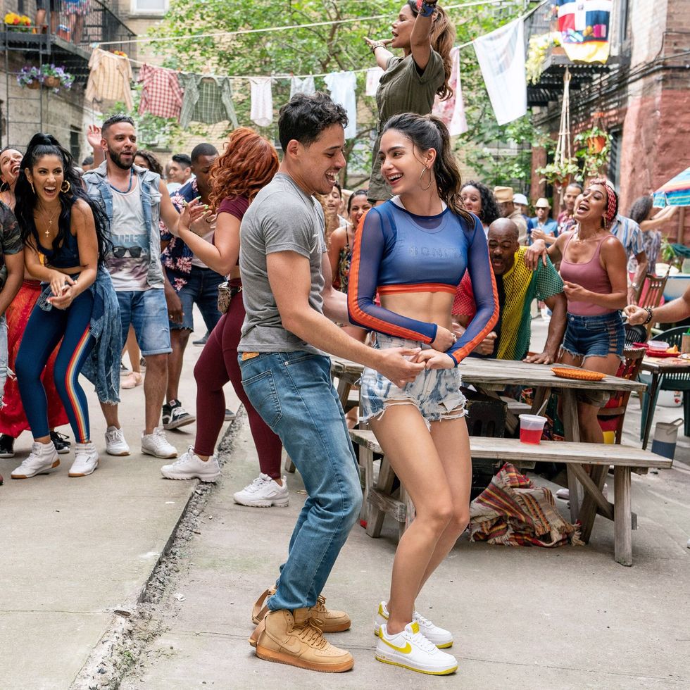 in the heights foreground from left anthony ramos, melissa barrera 2020  ph macall polay warner bros  courtesy everett collection