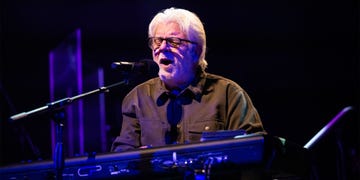 a man with a microphone on a stage