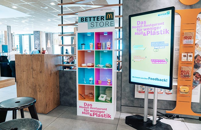 Lighting, Floor, Interior design, Display device, Advertising, Banner, Signage, Plywood, Shelf, Shelving, 