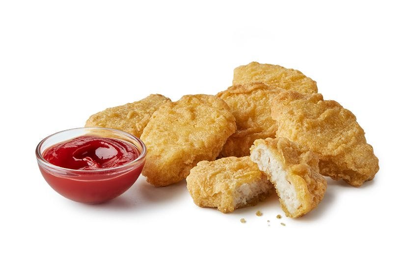 served chicken nuggets with a side of ketchup
