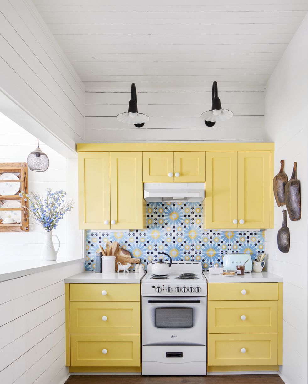tiny farmhouse kitchen with yellow cabinetry