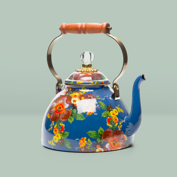 a teapot with flowers
