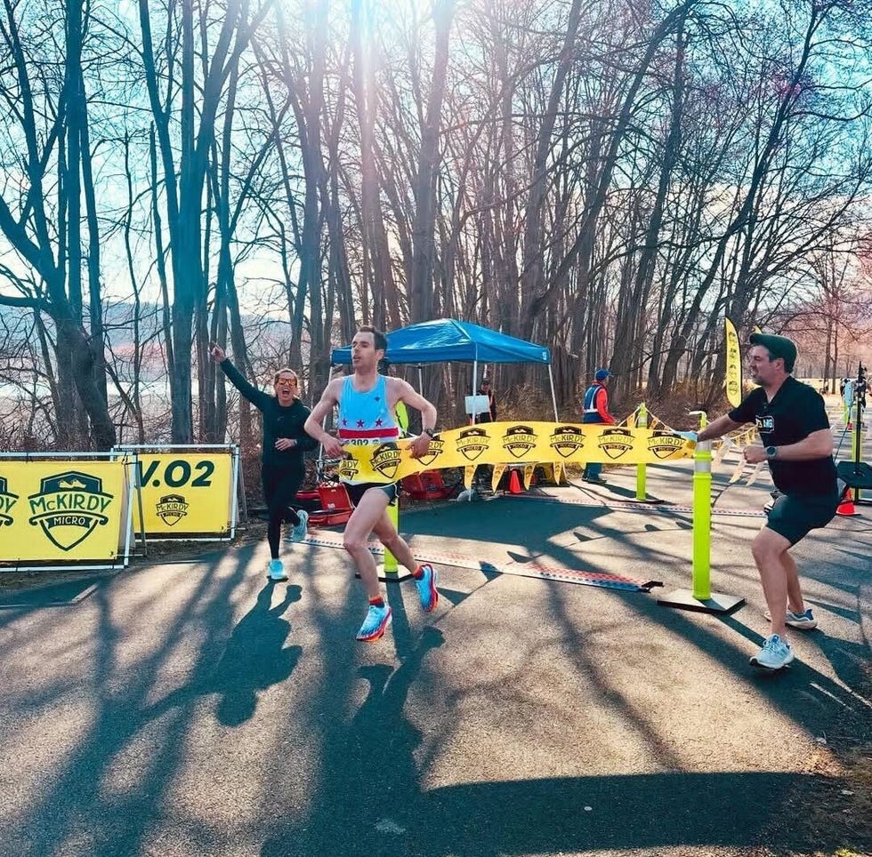 runner finishing a race at a checkpoint