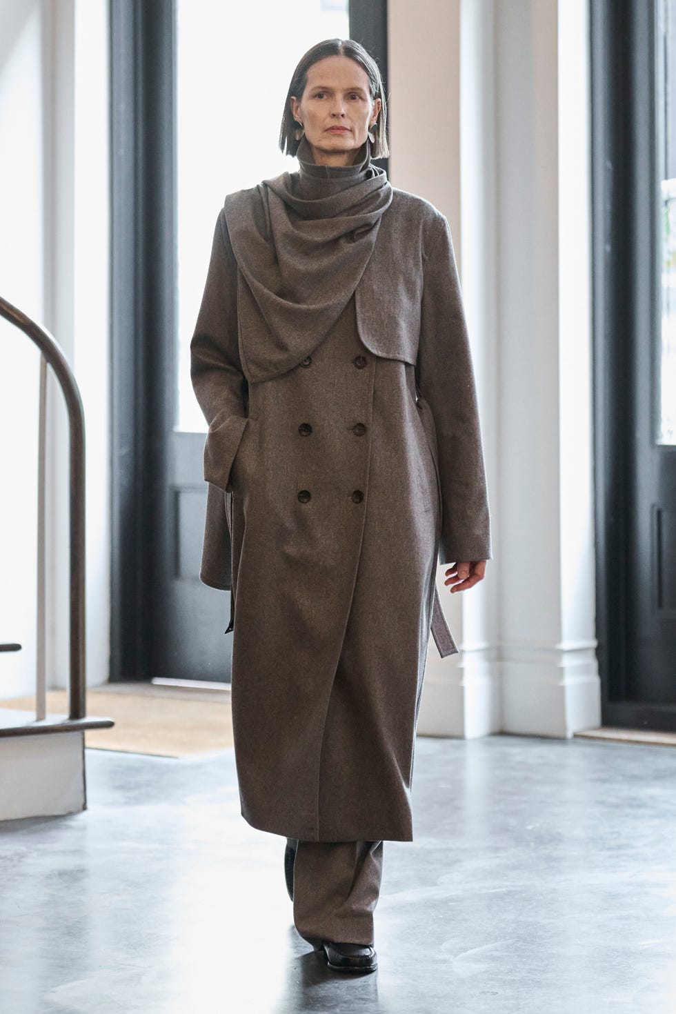 a model wearing a coat