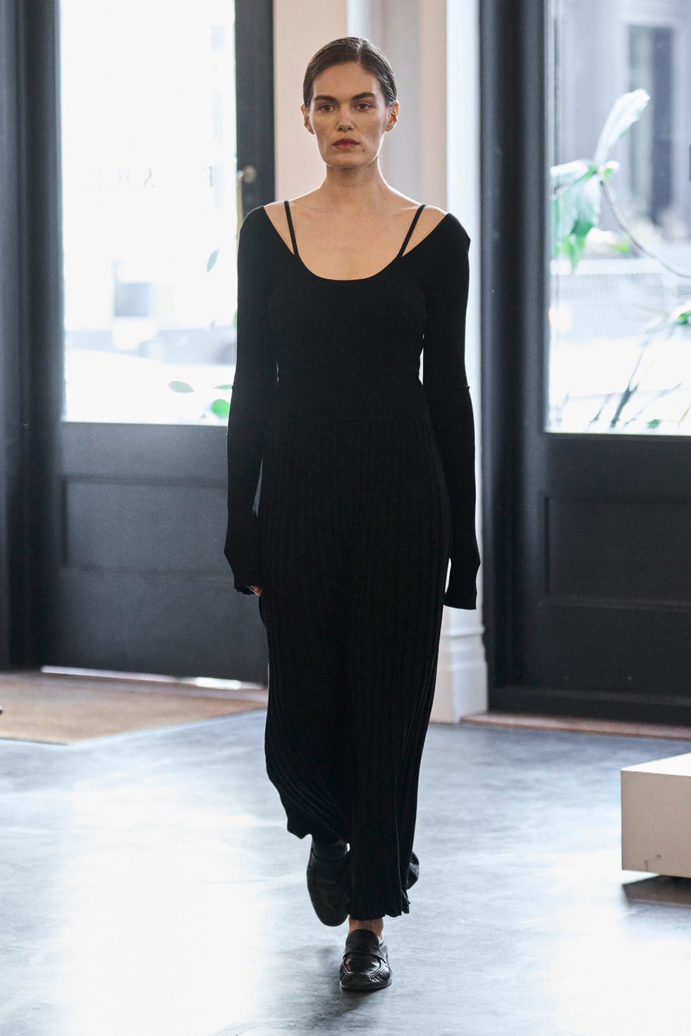 a model in a black dress