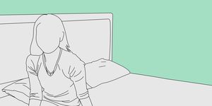 a line drawing of a woman sitting in bed alone