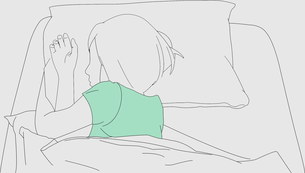 a line drawing of someone sleeping in bed