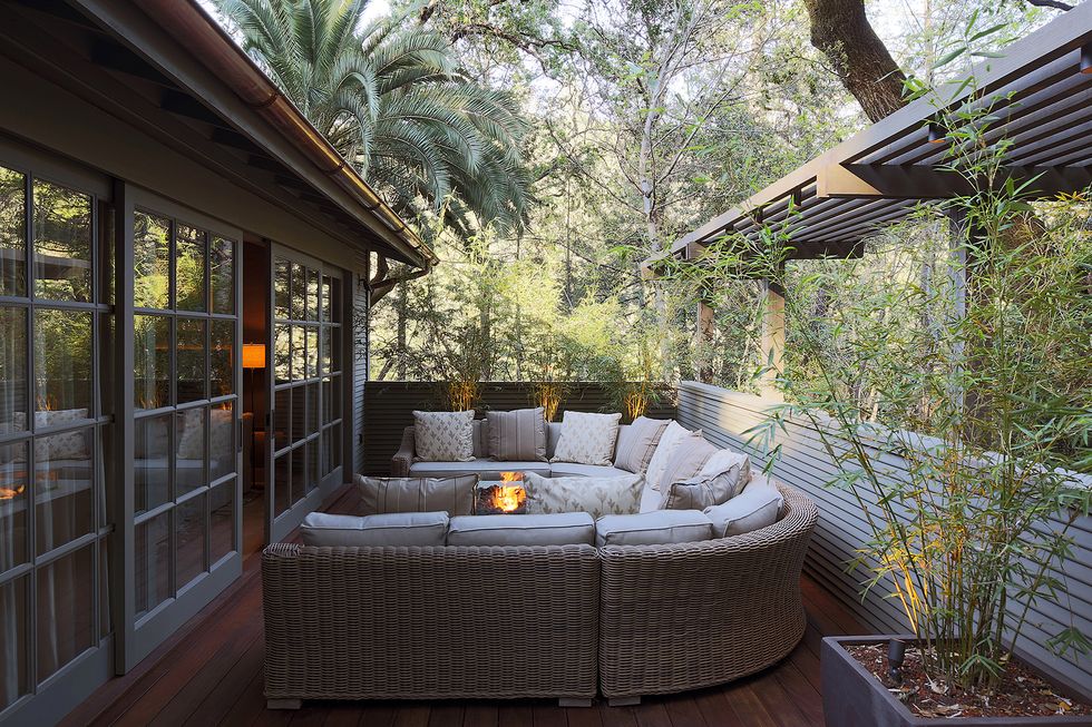 a cozy patio with a fire pit
