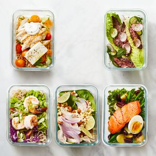 glass containers with a variety of meal prepped meals