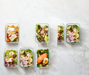 glass containers with a variety of meal prepped meals