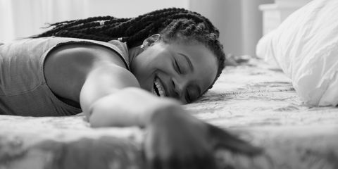 a woman asleep and smiling