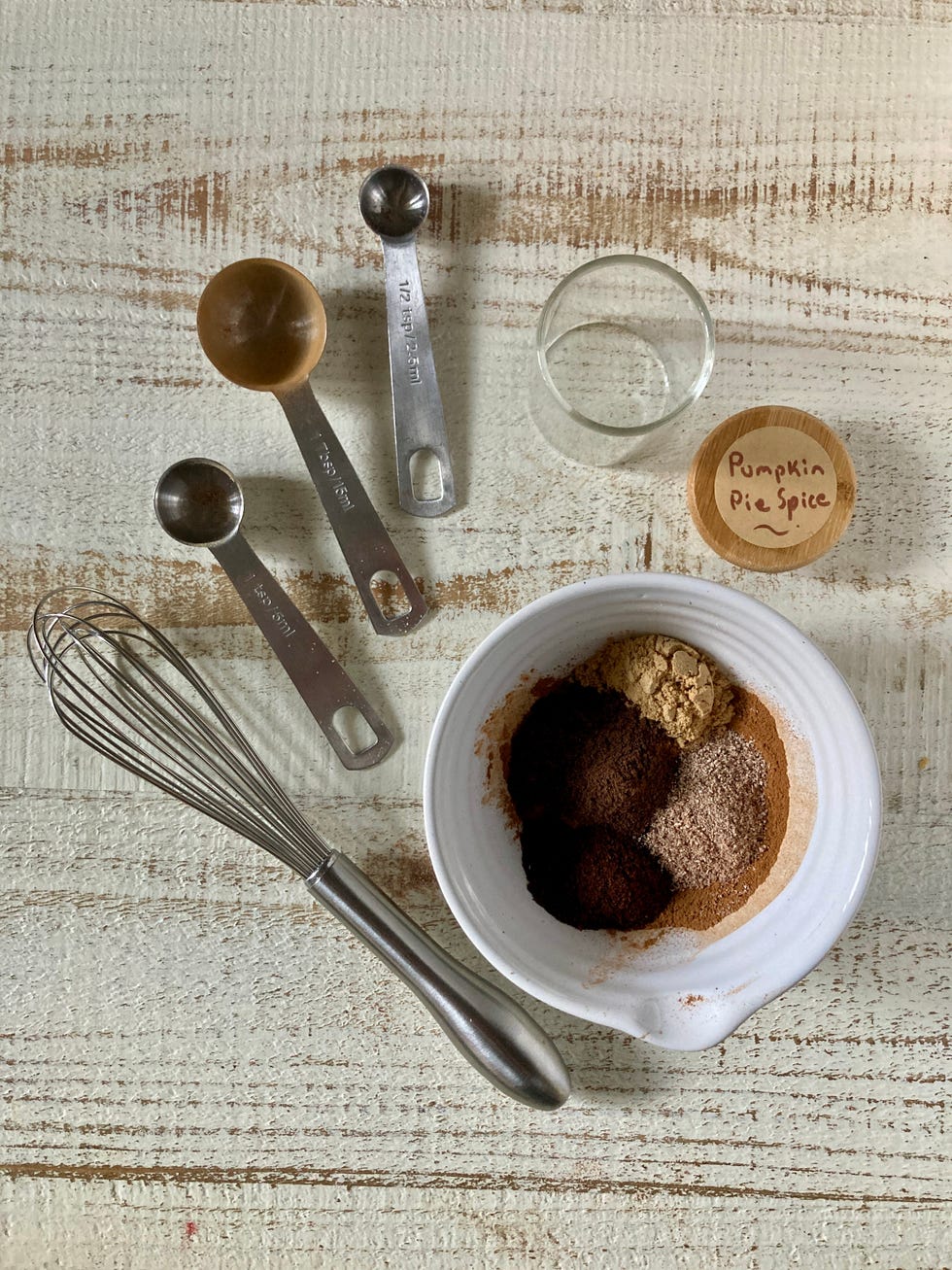 pumpkin pie spice ingredients in a bowl whisked together